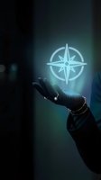 Hand holding glowing compass rose neon symbol against dark background, representing navigation, direction, guidance, and digital technology for business and design projects.
