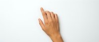 Human hand with index finger pointing upward on white background, isolated for design use in technology and touch screen concepts.