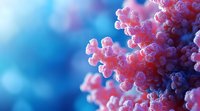 Pink coral branches with delicate texture against blurred deep blue ocean background, creating dreamy underwater atmosphere. Macro photography highlights intricate details.