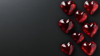 Red glass heart shapes scattered on dark background, romantic love concept with transparent crystal decorative elements for Valentine's Day designs.