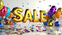 Festive gold foil SALE balloons with colorful party balloons and scattered confetti on reflective surface create celebratory shopping atmosphere.