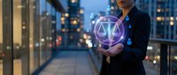 Professional businesswoman holding glowing digital justice scales hologram in modern city office building at night representing legal technology solutions.