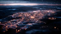 Aerial night view of illuminated mountain town with glowing streets and buildings surrounded by dark hills under starry winter sky. Scenic cityscape at dusk.