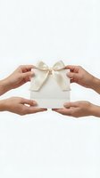 Multiple hands holding white gift box with cream silk ribbon bow on isolated background for holiday, celebration, and present concepts.