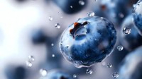 Fresh ripe blueberry with water drops falling in slow motion against blurred background, extreme macro shot showing detailed berry texture and juiciness.