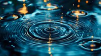 Mesmerizing water ripples with concentric circles on dark blue surface reflecting golden bokeh lights, creating tranquil and meditative pattern for wellness concepts.