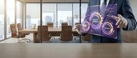 Professional businessman in suit presenting digital innovation interface with glowing purple holographic elements in modern corporate boardroom setting.