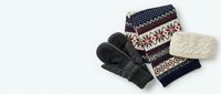 Cozy winter accessories set with knitted mittens, patterned scarf and warm beanie on white background for seasonal fashion and cold weather styling.