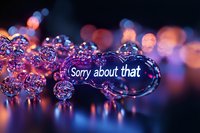 Sorry about that message in glowing purple neon text with bokeh lights and water drops creating magical reflective atmosphere on dark background.