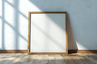 Empty golden square frame mockup standing on wooden floor against light blue wall with window shadow overlay, minimal interior design element.