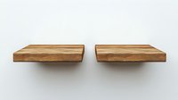 Floating wooden shelves with natural grain pattern mounted on white wall, minimalist interior design element for modern home decor and storage solutions.