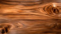 Natural wood grain texture with swirling patterns in rich brown and copper tones, featuring organic knots and flowing lines. Suitable for furniture design and interior decor.
