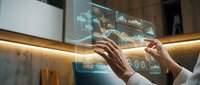 Young professional with medium skin tone analyzing financial data on interactive holographic display, wearing business attire, engaged in stock market analysis and digital investment planning.
