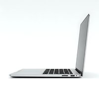 Modern silver laptop computer open at angle showing keyboard and screen isolated on white background for business technology presentations.