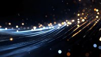 Glowing light trails with bokeh effect on dark background create dynamic motion and energy flow pattern for technology and communication concepts.