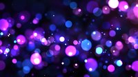 Glowing purple and blue bokeh lights create magical atmosphere on dark background, defocused circular light spots with soft blur effect for festive designs.