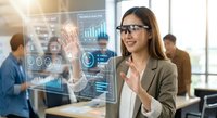 Professional businesswoman interacting with futuristic holographic interface displaying data analytics and charts in modern office environment.