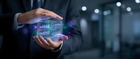 Businessman in dark suit holding glowing digital hologram with financial charts, graphs and data analytics interface for business intelligence and technology solutions.