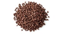 Pile of dark chocolate chips scattered on white background, isolated food ingredient for baking and confectionery. Clean macro shot with sharp details.