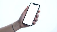 Hand holding modern smartphone with blank white screen mockup for app presentation and mobile interface design on clean background.