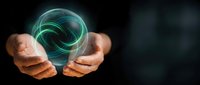 Businessman hands protecting glowing green energy sphere with swirling light trails representing renewable power, sustainability and environmental protection.