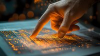 Finger touching glowing digital surface with orange light effects and bokeh background, futuristic technology concept for business and innovation.