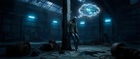 Futuristic robot standing in abandoned industrial facility with glowing holographic brain projection overhead in dark atmospheric sci-fi setting.