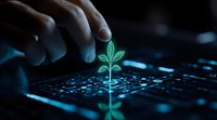 Small green plant sprout growing from computer keyboard in dark environment with hand reaching towards it, representing digital transformation and sustainable technology.