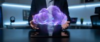 Businessman holding glowing purple holographic brain projection in modern office environment representing artificial intelligence and neurotechnology concepts.