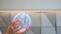 Young adult with medium skin tone holding glowing digital sphere with network connections, representing technology, innovation, and global communication for business and digital transformation concepts.