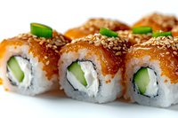 Fresh sushi rolls with salmon, cream cheese, cucumber, and sesame seeds on white background, close-up view showing texture and layers of Japanese cuisine.
