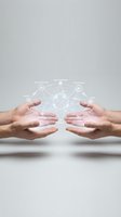 Two hands holding digital network visualization with connected nodes and data flow icons for business technology concepts.