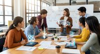 Diverse business team collaborating in modern office meeting room with startup strategy presentation on whiteboard and documents.