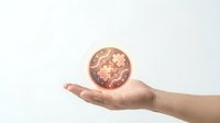 Hand holding glowing digital coin with puzzle pieces, symbolizing blockchain solution, crypto innovation, and technology integration concept.
