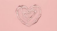 Pink heart-shaped cosmetic cream texture on pastel background for skincare and beauty product design applications.