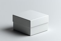 White square gift box with lid on light background, minimalist packaging mockup for product presentation and branding design projects.