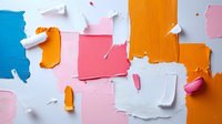 Vibrant torn paper collage with orange, pink, blue and white pieces creating abstract composition on light background. Modern artistic layout for design projects.
