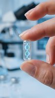 Scientist holding transparent capsule with glowing DNA helix inside modern laboratory for genetic research and biotechnology applications.