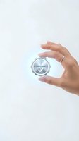 Hand holding glowing compliance badge with checkmark symbol representing business standards and regulatory adherence for corporate presentations.