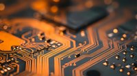 Orange illuminated circuit board with microchips and electronic components showcasing modern technology and digital innovation for tech presentations.