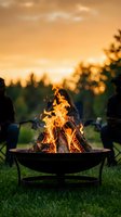 Cozy fire pit with burning logs on green grass during golden hour sunset creating warm outdoor gathering atmosphere for backyard entertaining and relaxation.
