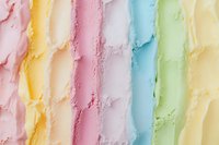 Colorful pastel ice cream scoops in rainbow pattern creating abstract textured background. Smooth creamy stripes of strawberry, mango, vanilla, mint flavors.