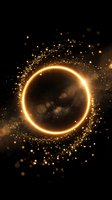Golden glowing circle with sparkling particles and bokeh lights on dark background for luxury design and cosmic themes.