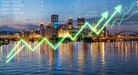 Modern city skyline at dusk with glowing green financial growth arrow overlay representing economic success and market trends in urban business district.