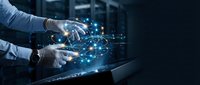 Businessman hands using tablet with glowing network connections and digital technology interface in modern office environment for business innovation.