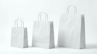 Three white paper shopping bags in different sizes with handles isolated on white background for retail packaging and commercial use.
