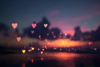 Romantic heart-shaped bokeh lights floating over serene water at sunset with purple and orange sky creating dreamy Valentine's atmosphere for love concepts.