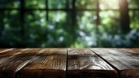 Rustic wooden table surface with natural wood grain texture against blurred green forest bokeh background, sunlight streaming through trees.