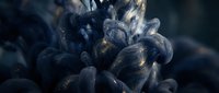 Dark blue ink swirling in water with golden glitter particles, creating dramatic abstract cloud formations on deep navy background.