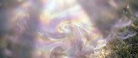 Mystical swirling energy with golden and purple hues creating magical spiral patterns above natural moss surface for spiritual and fantasy concepts.
